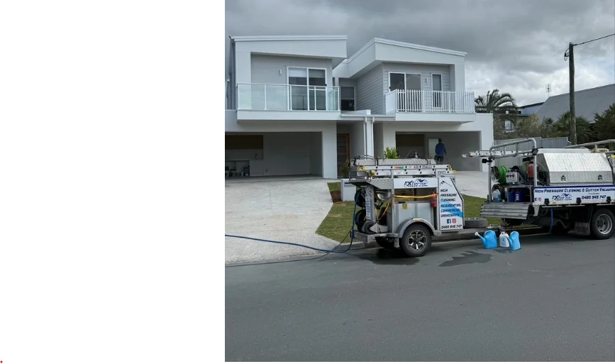 Xterior Power Clean truck and trailer outside a modern two-storey home being prepared for listing