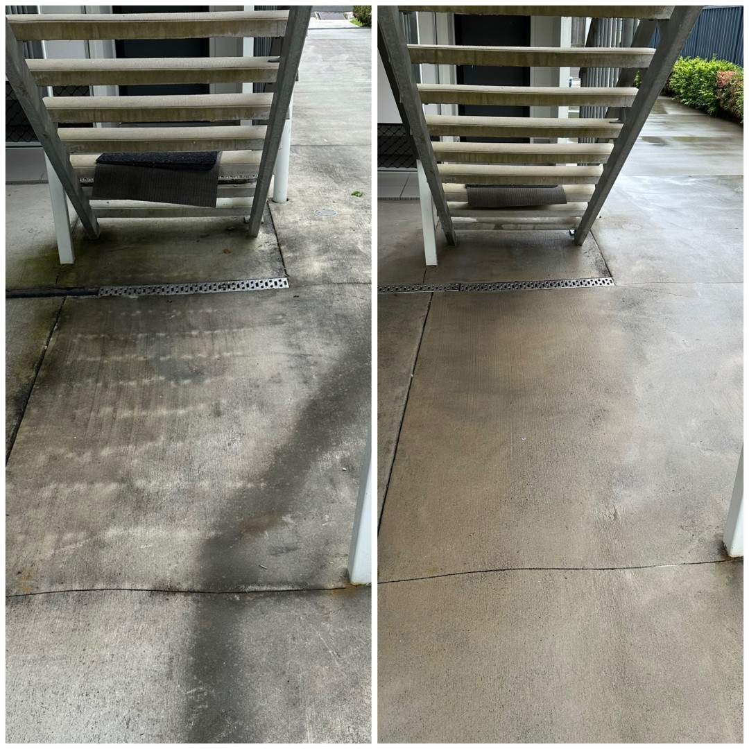 Before and after: concrete landing under a stairwell cleaned
