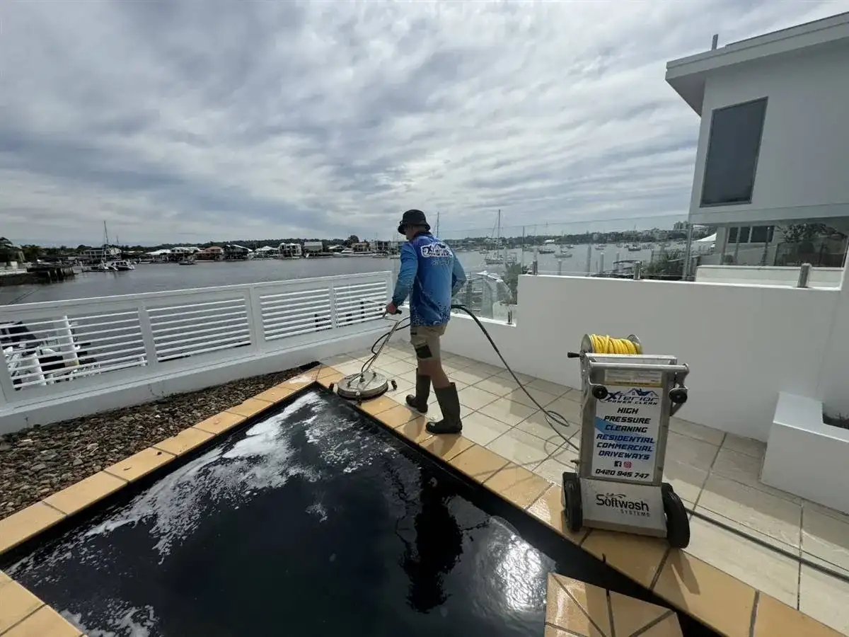 Tiled pool surrounds cleaned at a waterfront home