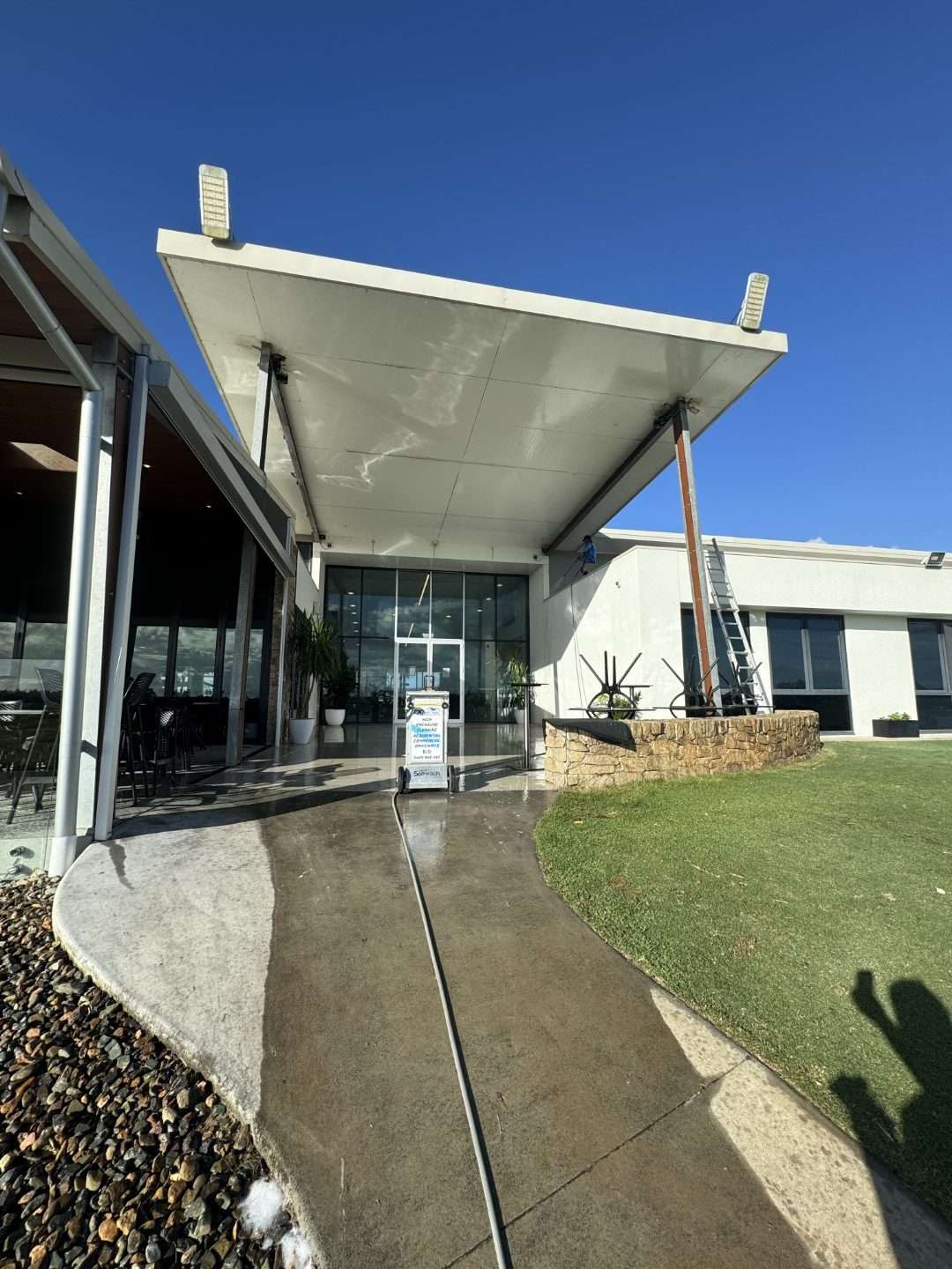 Xterior Power Clean cleaning the entrance facade of a commercial building
