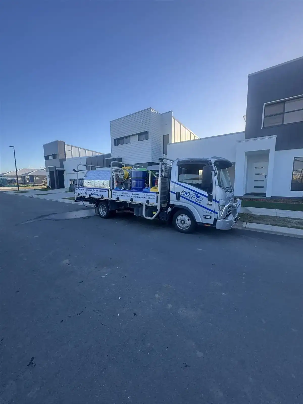 The branded Xterior Power Clean truck on site at a job